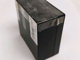 a black box that is sitting on a white surface