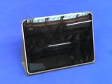 a black tablet computer sitting on a blue surface