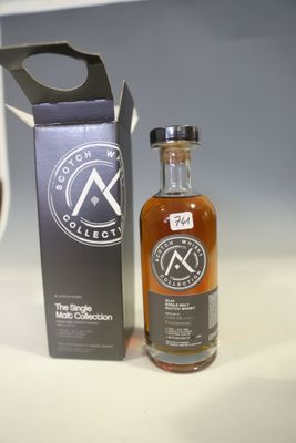an image of a bottle of alcohol sitting next to a bottle of wine