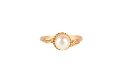 a gold ring with a pearl in the center