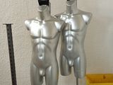 two mannequins that are on display in a room