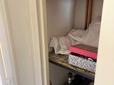 a closet full of bottles and bottles of wine