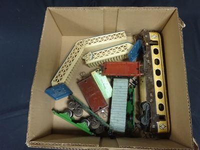 a box full of toy trains sitting on a blue surface