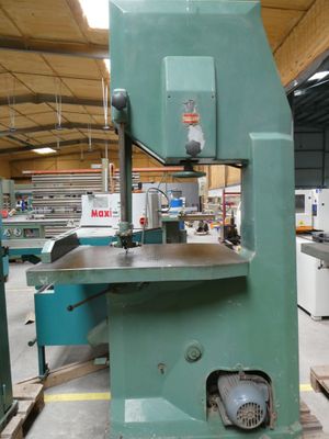 a machine that is sitting in a factory with a lot of machines