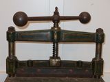 a green and black machine that is sitting on a table