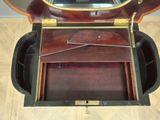 a wooden box with a mirror on top of it