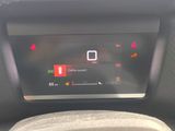 the dashboard of a car with a digital display on it
