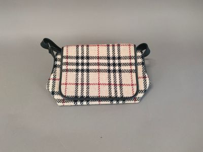 a small purse with a checkered pattern on the front