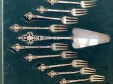 many forks and spoons in a display case