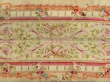 an antique rug with a floral design on a white background