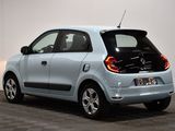 an image of a small blue car in a room