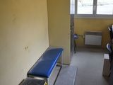 a blue bench in the middle of a room