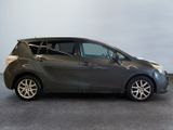 the small car is parked in the garage on the concrete floor