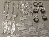 a table with a lot of jewelry and tags on it
