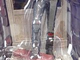 a statue of a man that is in a glass case