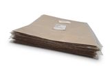 a stack of brown paper on a white surface