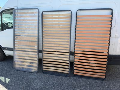 three wooden slats on the side of a white van