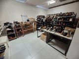 a room filled with lots of shoes and boxes