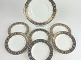 a set of six plates with blue and white designs on them