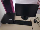 a desktop computer sitting on a desk with a keyboard and mouse