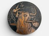 a clock with a bull on it on a white surface
