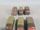 six toy cars that are lined up in a row