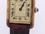 a close up of a wrist watch with roman numerals
