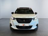 the front view of a white car in a showroom
