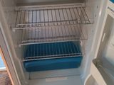 an open refrigerator that has some food inside of it