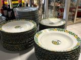 a lot of plates on a table in a store
