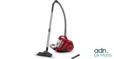 a red vacuum cleaner sitting on top of a white surface