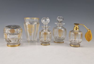 several glass bottles and vases are lined up on a table