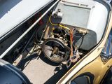 a small car with a steering and some wires in it