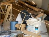 a pile of boxes and other items in a garage