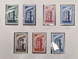 a close up of a bunch of stamps on a sheet of paper