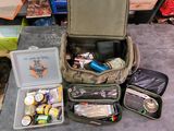 a suitcase with a lot of things in it on the floor