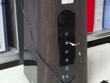 an image of a black and gray speaker on a table