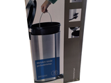 someone is opening the box of a trash can with the lid open