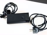 a black charger with a cord attached to it