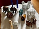 many figurines sitting on a table in the living room