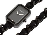 a black watch with a chain around it on a white background
