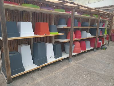 many boxes and bins on the shelves in the store