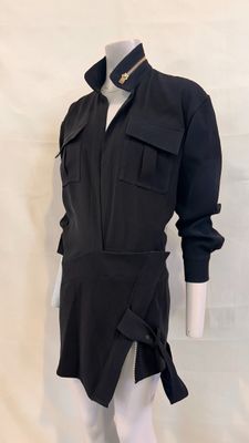 the mannequin is wearing a black shirt and white pants