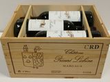 bottles of red wine in a wooden box on a table