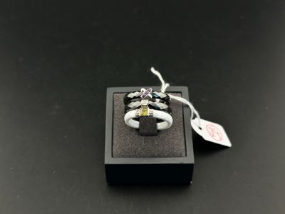 a close up of a ring in a box on a table