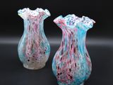 two vases that are sitting next to each other