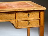 a wooden desk with three drawers and a leather top