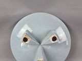 a white plate with three pieces of glass on it
