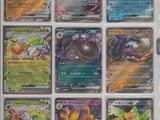 pokemon cards are displayed in a display case on a table