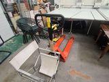 a room with a lot of chairs and tables in it